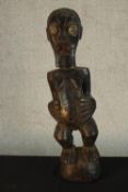 A late 19th/early 20th carved Songye Congoalise hardwood figure. H.65 W.16 D.10cm.