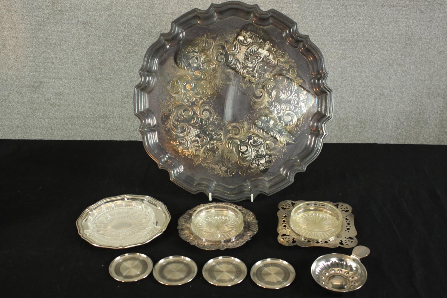 A collection of silver plate and pewter, including three pierced design butter dishes, a taste de