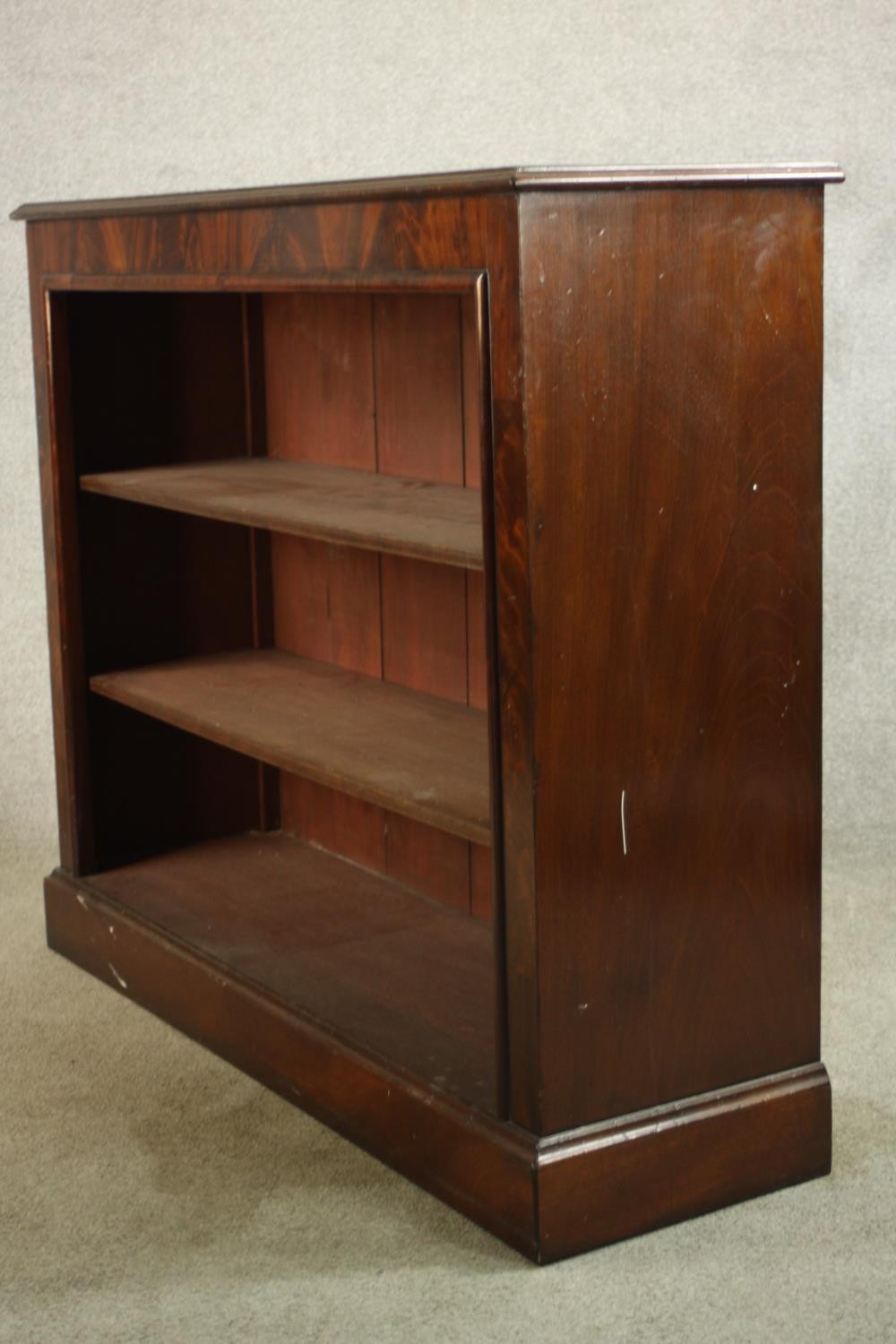 A 20th century mahogany three tier open bookcase, raised on block plinth base. H.102 W.121 D.38cm. - Image 3 of 7