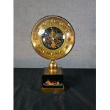 A mid 20th century Russian mantle clock, with hand painted spherical dial and base, decorated with
