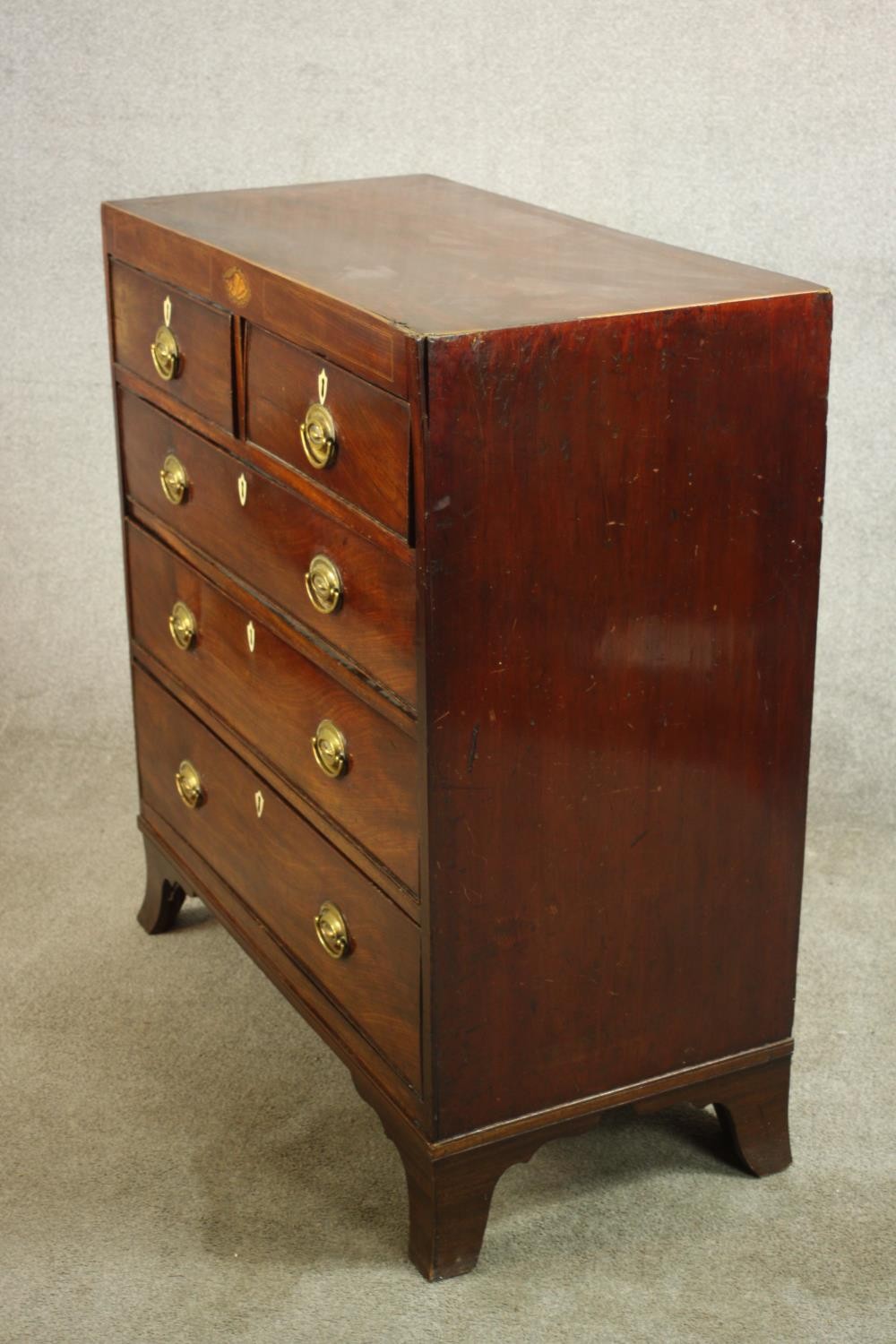 A Georgian inlaid mahogany chest of two short over three graduating drawers, raised on shaped - Image 5 of 8