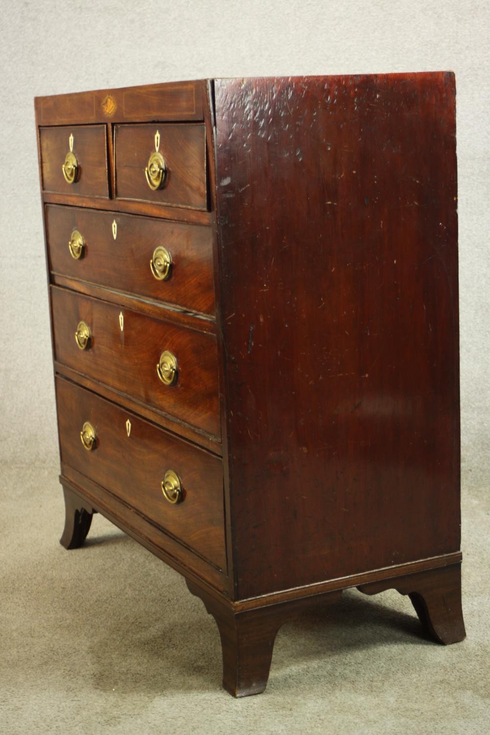 A Georgian inlaid mahogany chest of two short over three graduating drawers, raised on shaped - Image 6 of 8