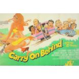 A Carry on Behind (1975) framed and glazed British Quad film poster. H.83 W.108cm.