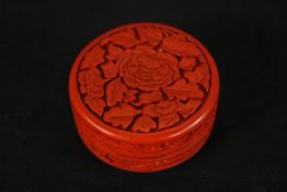 A late 19th/early 20th century Chinese red cinnabar lacquer cylindrical box and cover, carved with