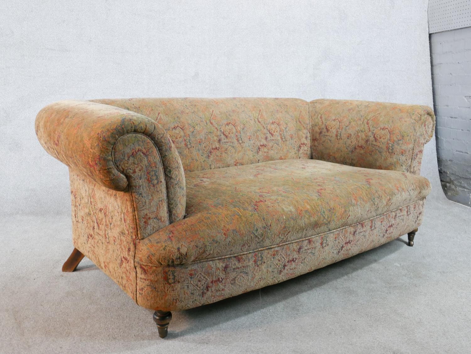 A 19th century upholstered two seater scroll arm settee, raised on turned supports. H.66 W.170 D. - Image 4 of 4