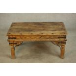 An late 20th century Eastern hardwood and cast iron table raised on turned supports. H.44 W.90 D.