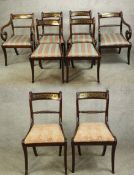 A set of eight Regency mahogany and brass inlaid bar back dining chairs, comprising of two open