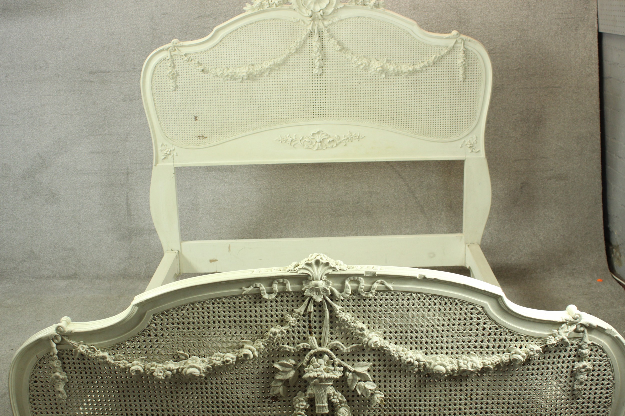 A 20th century painted hardwood and bergère single bed frame, with applied wreath and swag - Image 4 of 10