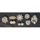 A collection of nine Danish silver and white metal traditional folk costume brooches, one with a
