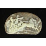 A cameo design moulded resin statement belt buckle depicting a horse pulled chariot and riders. H.