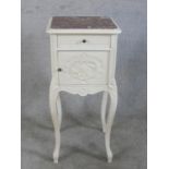 A 20th century French style marble top pot cupboard, with single drawer and door, raised on cabriole