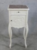 A 20th century French style marble top pot cupboard, with single drawer and door, raised on cabriole