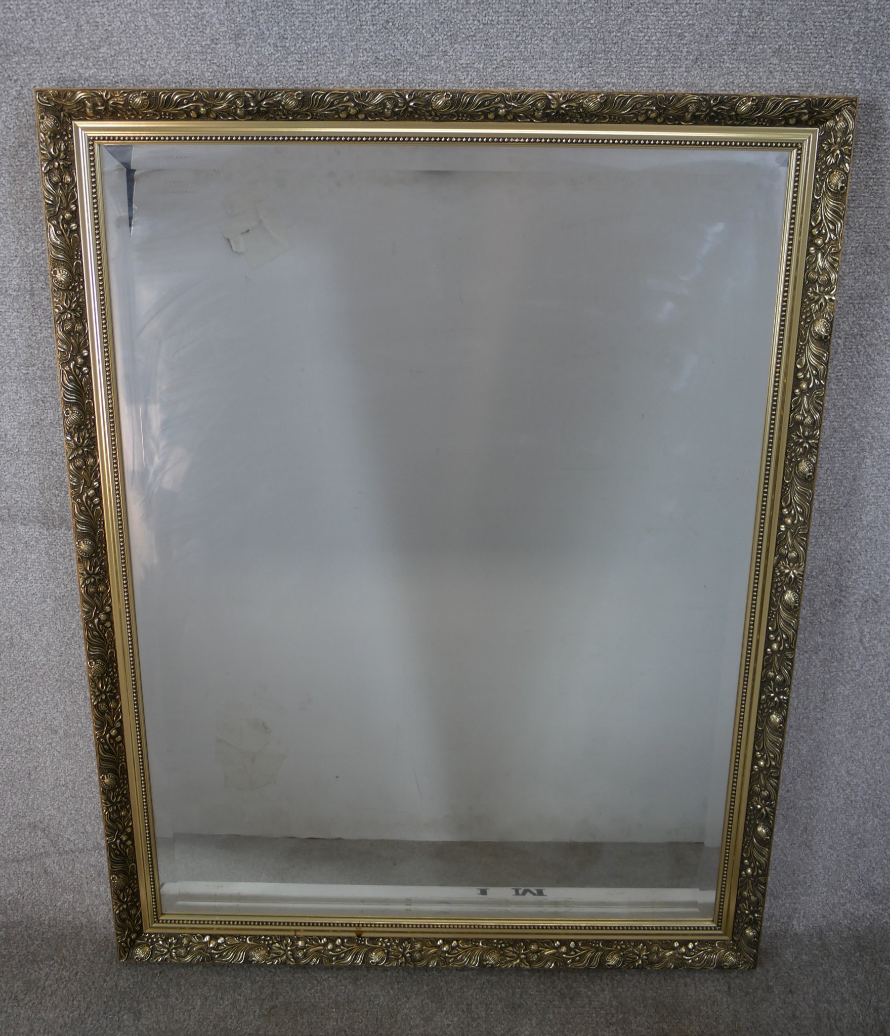 A 20th century gilt framed rectangular wall hanging mirror. H.112 W.87cm