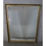 A 20th century gilt framed rectangular wall hanging mirror. H.112 W.87cm