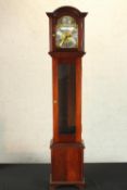 A 20th century mahogany cased Tempus Fugit grandmother clock, the brass and silvered dial with black