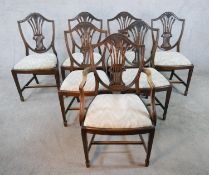 A set of seven mahogany framed Hepplewhite style dining chairs, comprising of six singles and one