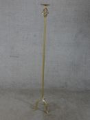 A 20th century gilt brass torchiere, the slender column raised on three outswept supports. H.140 W.