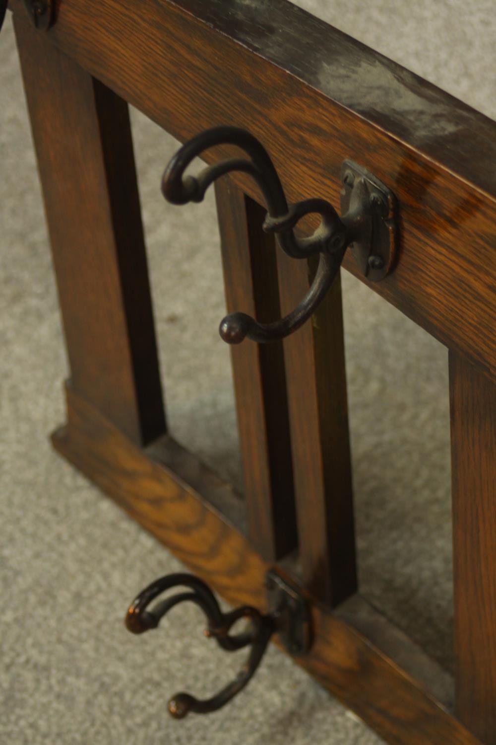 An early 20th century stained oak wall hanging mirror/coat stand. H.47 W.107 D.12cm. - Image 6 of 8