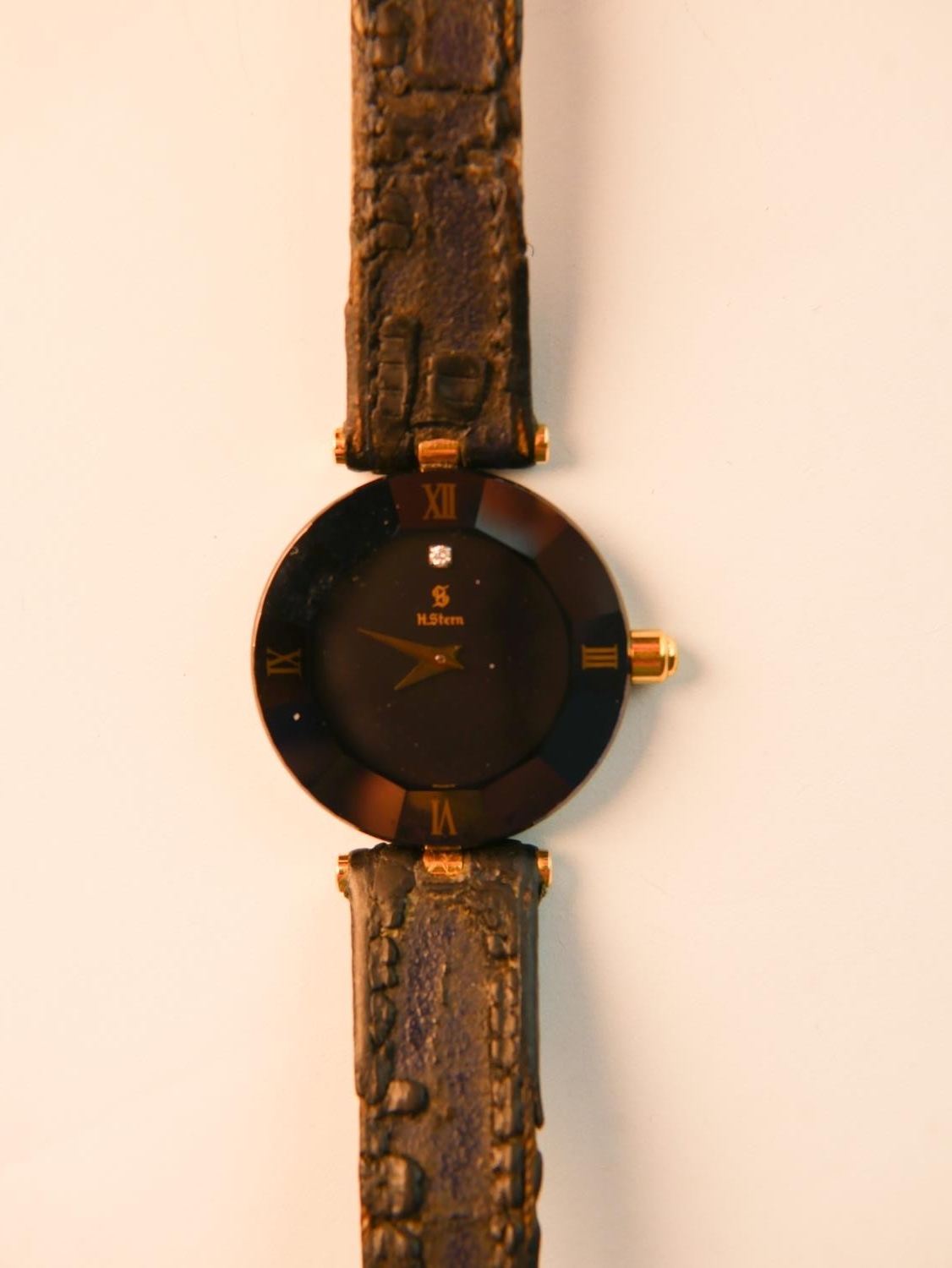 A late 20th century H. Stern ladies wristwatch, with Roman numerals and gilt hands, diamond inset at