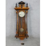 A 19th century mahogany cased Vienna style wall clock, the dial with black Roman numerals and