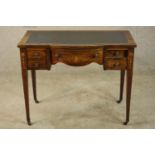 An Edwardian inlaid rosewood bowfronted leather topped writing desk, with single long drawer