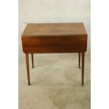 A George III mahogany Pembroke style table, raised on square tapering supports. H.70 W.90 D.76cm. (