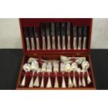 A contemporary canteen of silver plated flatware, in a fitted mahogany box. H.10 W.46 D.31cm. (box)