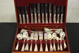 A contemporary canteen of silver plated flatware, in a fitted mahogany box. H.10 W.46 D.31cm. (box)