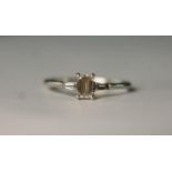 A boxed Art Deco style platinum and diamond flanked solitaire ring. Set to centre with a 0.51