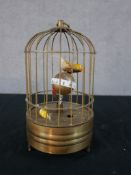 A 20th century brass bird cage novelty automaton clock. H.19 W.12 D.12cm