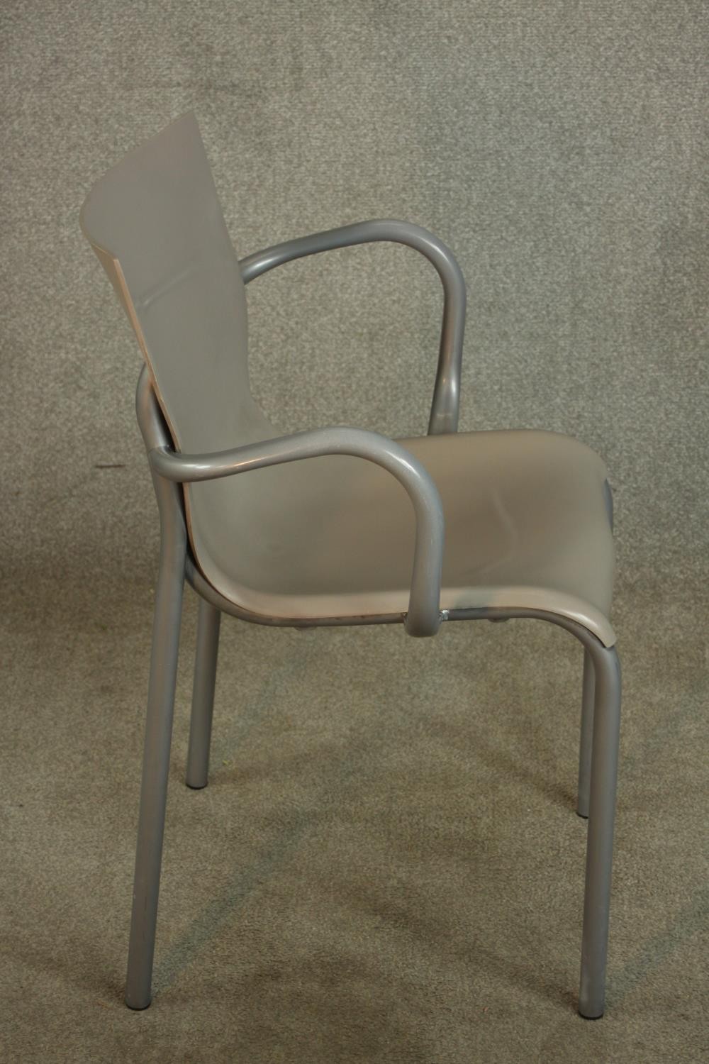 A mid 20th century leather and brushed steel open armchair, raised on straight supports. - Image 3 of 5