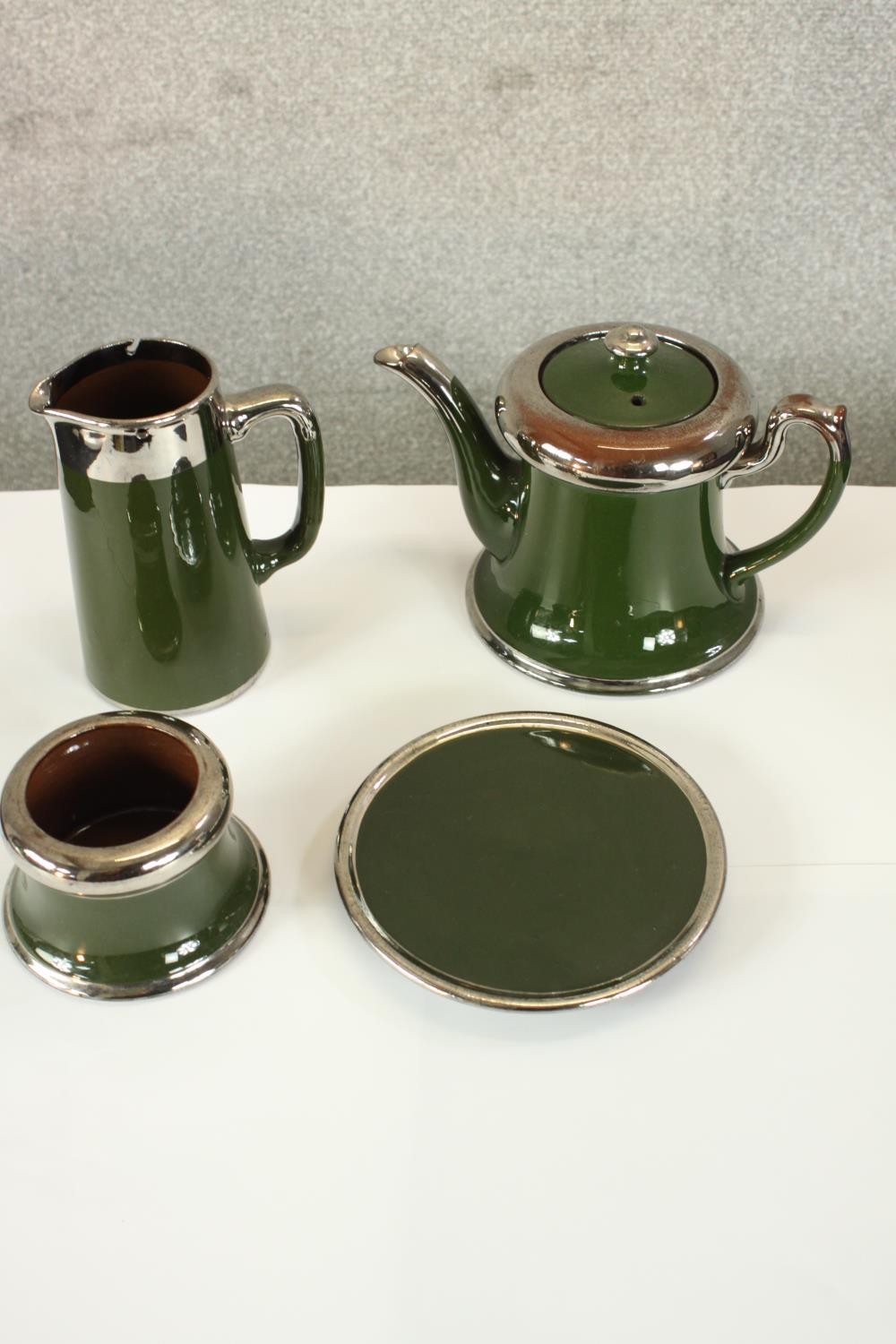 A 20th century, possibly French four piece painted pottery coffee set. H.17 W.8 D.13cm. (largest)