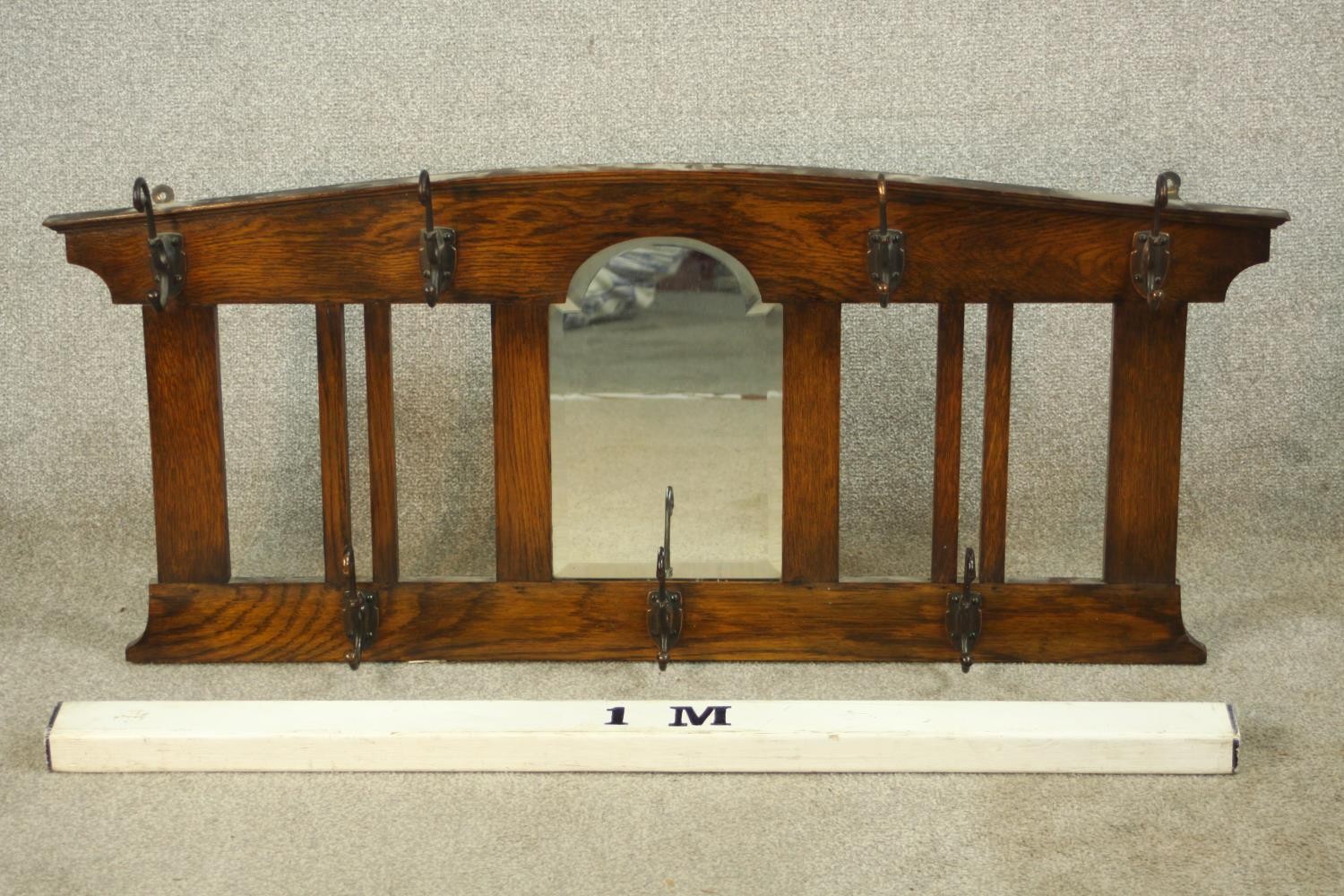 An early 20th century stained oak wall hanging mirror/coat stand. H.47 W.107 D.12cm. - Image 2 of 8
