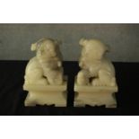 A pair of 20th century Chinese soapstone carved Dogs of Fo bookends, with incised detail decoration,