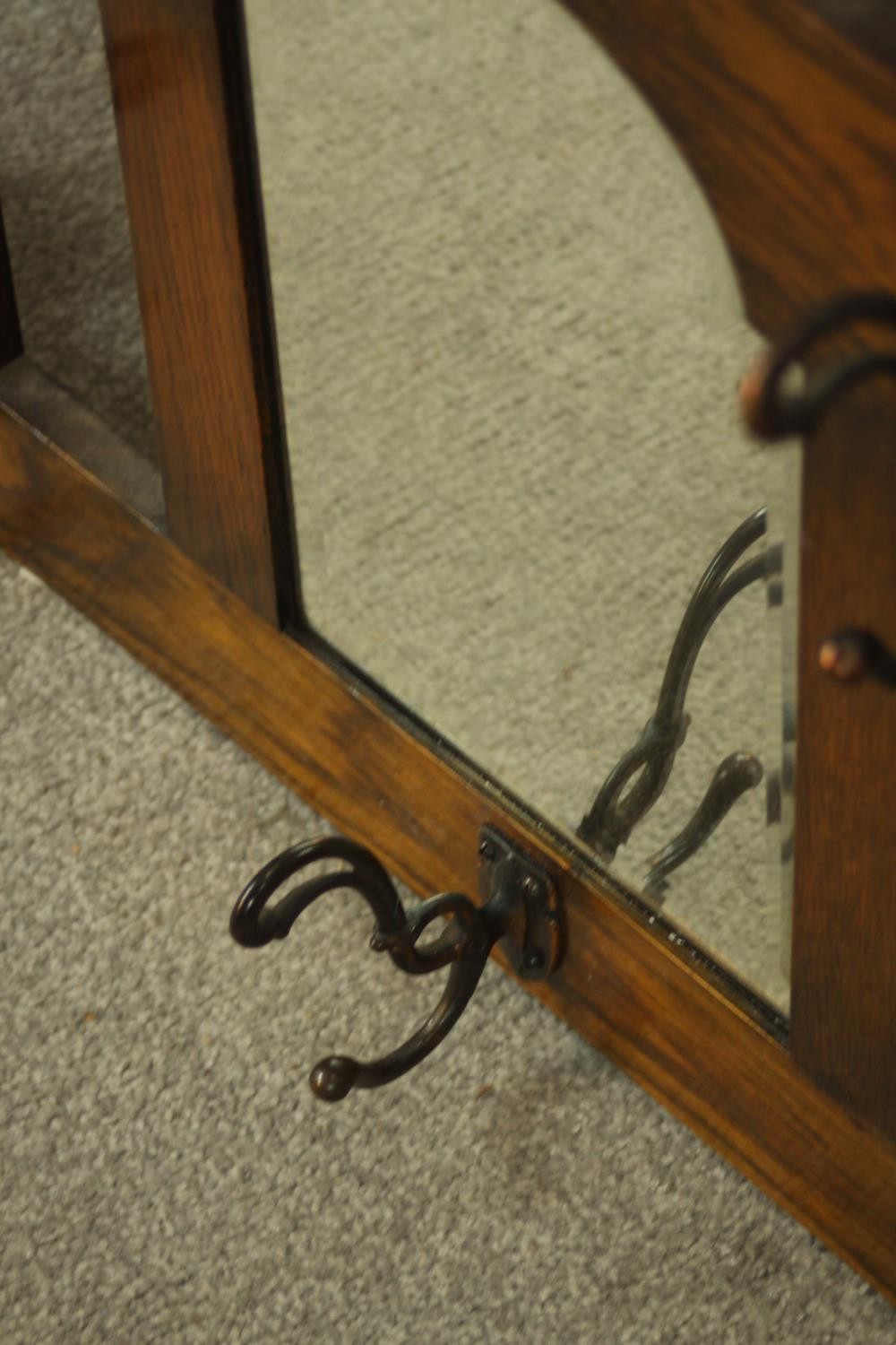 An early 20th century stained oak wall hanging mirror/coat stand. H.47 W.107 D.12cm. - Image 7 of 8