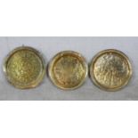 Three 20th century Indian embossed brass circular trays. Dia. 49cm (largest)
