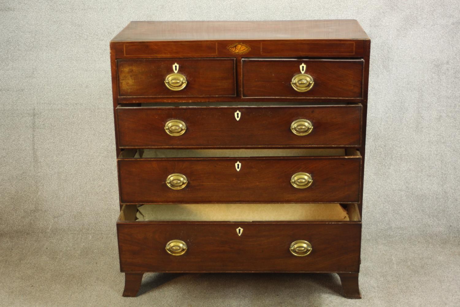 A Georgian inlaid mahogany chest of two short over three graduating drawers, raised on shaped - Image 3 of 8