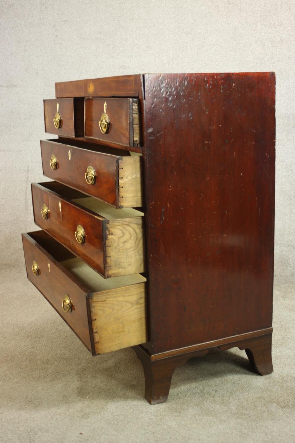 A Georgian inlaid mahogany chest of two short over three graduating drawers, raised on shaped - Image 7 of 8