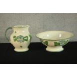 A 20th century Poole Pottery 'Vineyard' jug and bowl set, decorated with grapes and vine leaves. H.