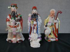 Three Chinese polychrome porcelain Immortal figures, together a Chinese Blanc de Chine porcelain