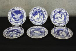 A set of six Minton blue and white pottery plates, designed with various animals by John Moyr Smith,