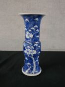 A 19th century Chinese blue and white porcelain Gu shaped vase, decorated with prunus flowers,