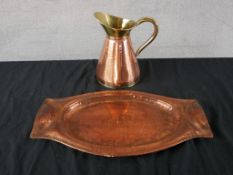 A 20th century Newlyn School twin handled hammered copper tray, together with a hammered copper
