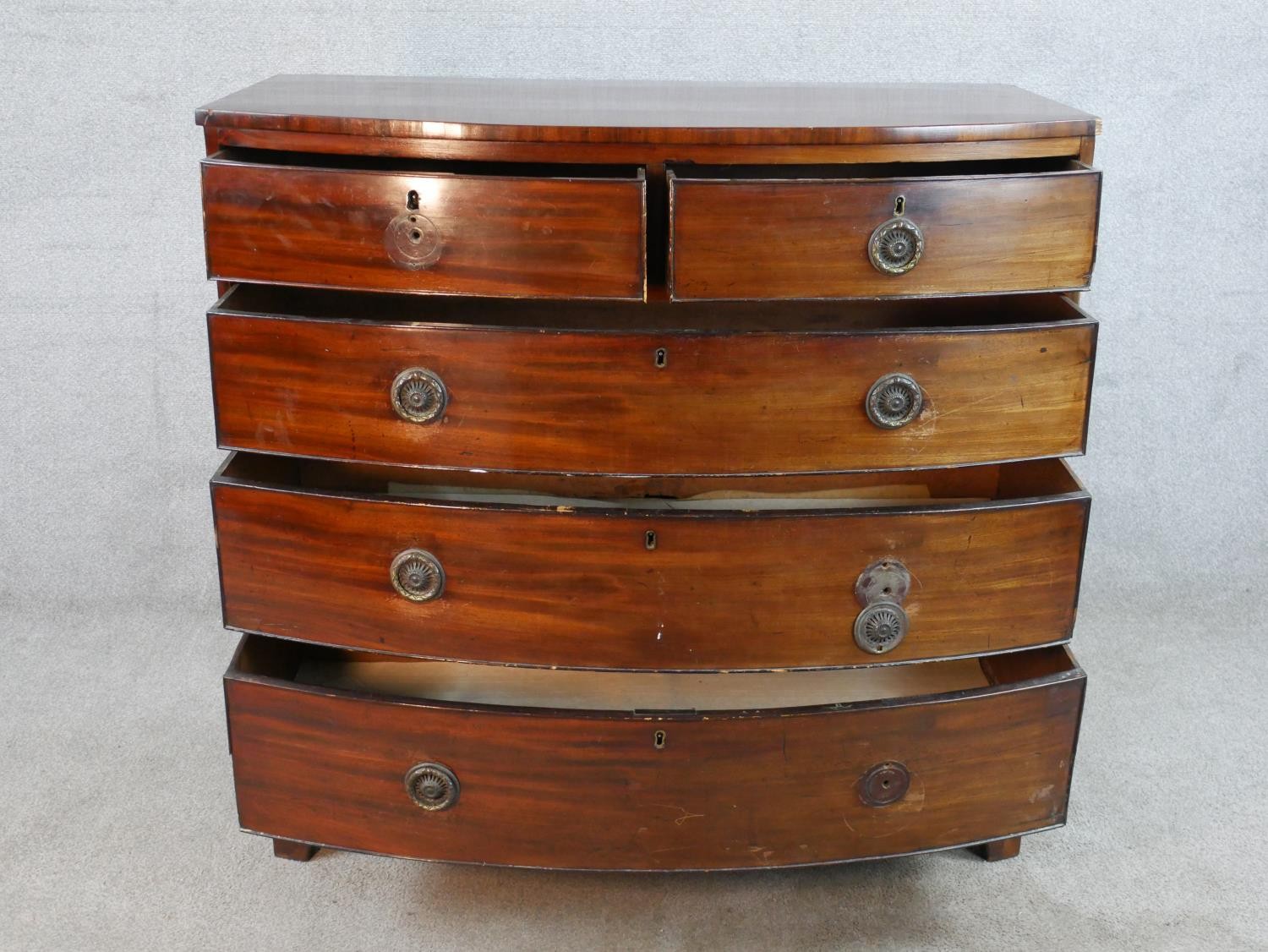 A 19th century mahogany bow fronted chest of two short over three long drawers, raised on shaped - Image 2 of 7