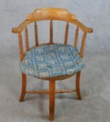 A 20th century pine framed bow back chair with barley twist spindles, raised on four splayed