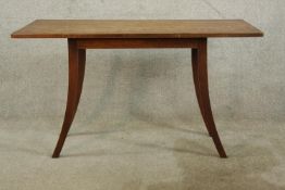 A 19th century Arts & Crafts style oak table, raised on four splayed tapering supports. H.60 W.107