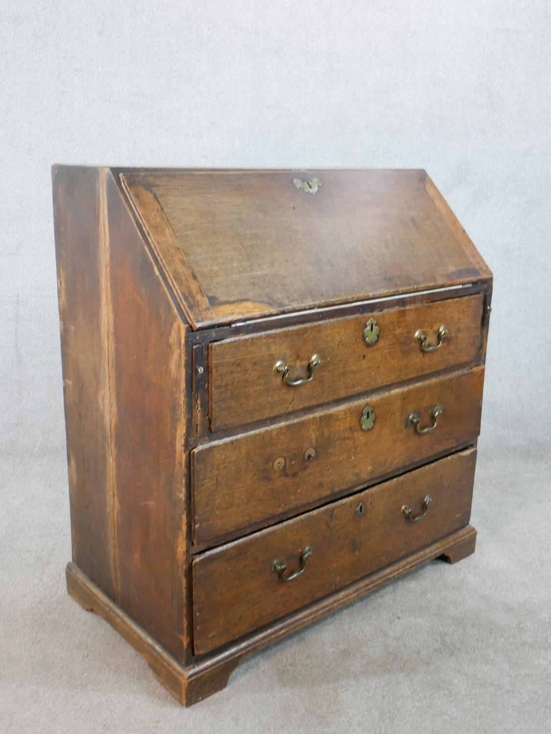A 19th century oak fall front bureau, the fall front opening to reveal fitted interior, above - Image 9 of 9