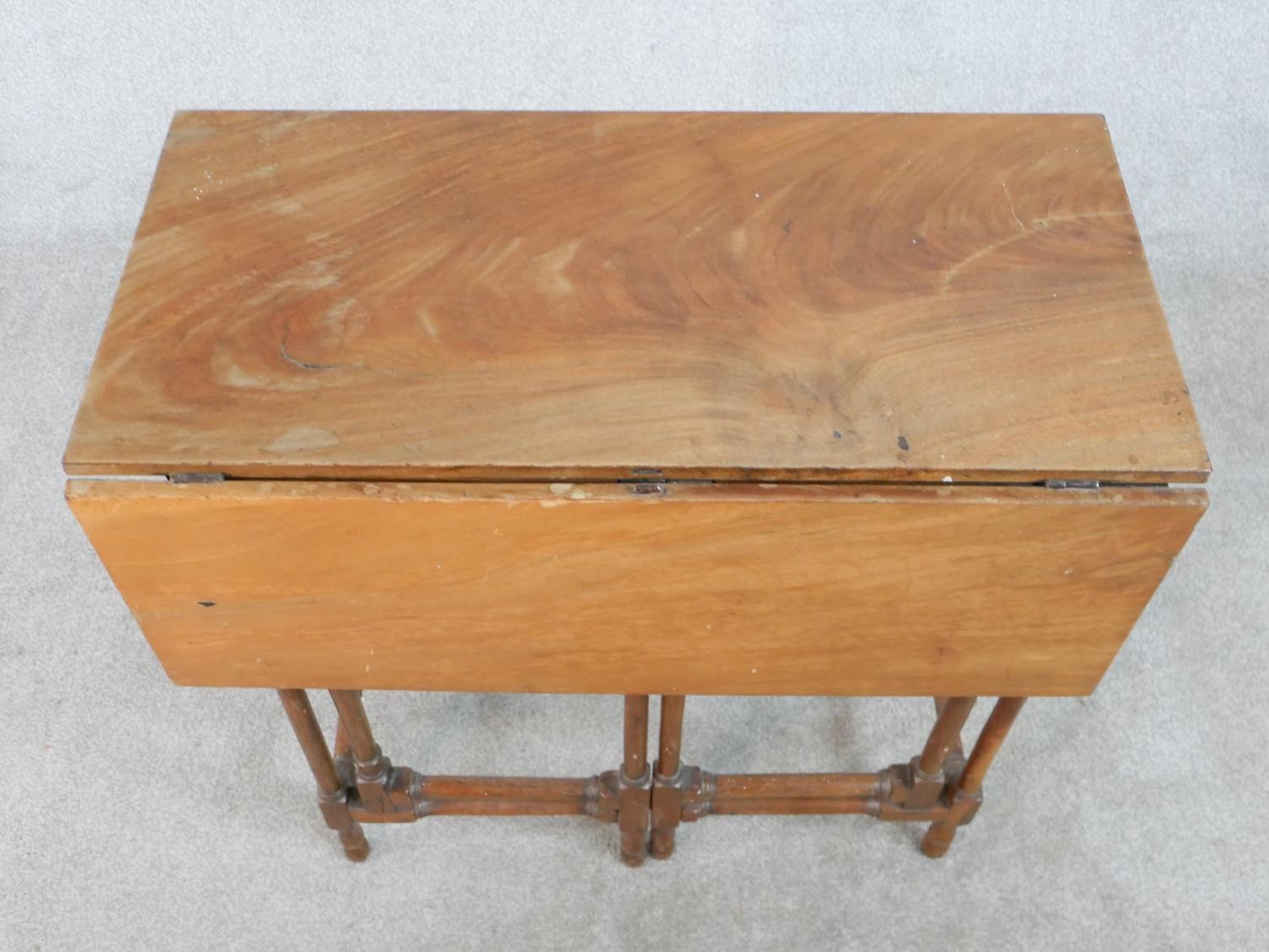 A 19th century mahogany drop leaf gate leg table raised on slender spider leg supports. H.71 W.71 - Image 2 of 5
