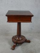 A William IV mahogany sewing table, the central column raised on stepped circular base with three