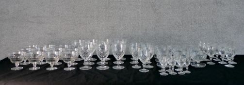 Approximately fifty cut and moulded drinking glasses, to include Webb and others.